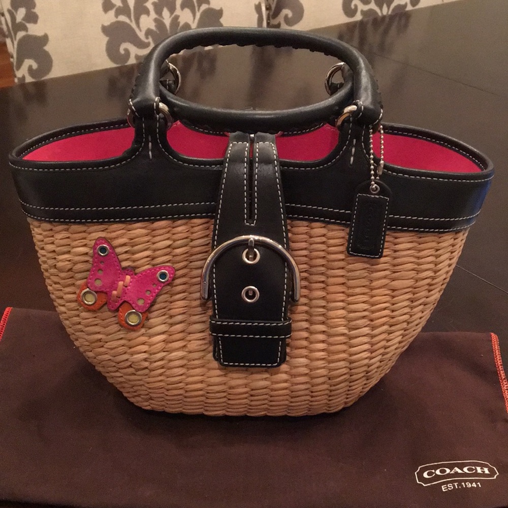 Rare COACH leather trim woven straw tote.